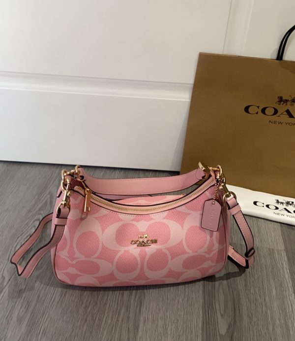 Teri Hobo Bag In Signature Canvas Pink CAL52
