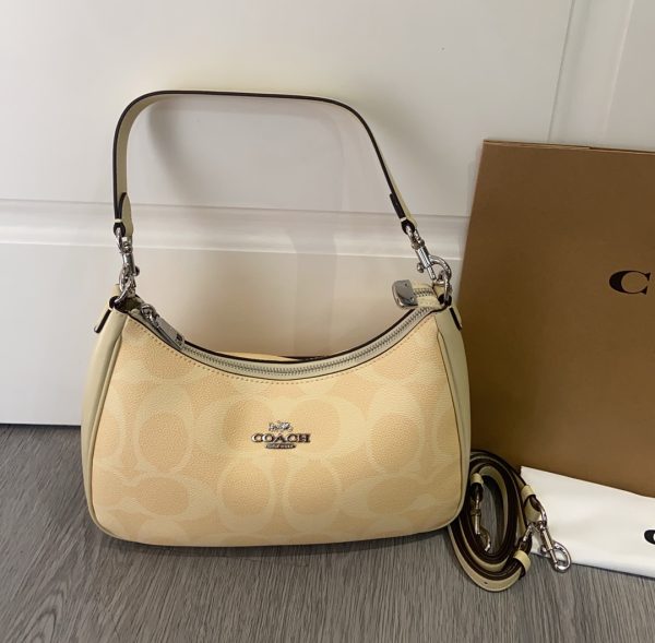 Teri Hobo Bag In Signature Canvas Hay CAL52