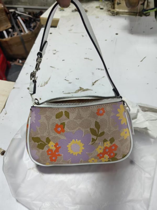 Nolita 19 In Signature Canvas With Floral Print CBM73